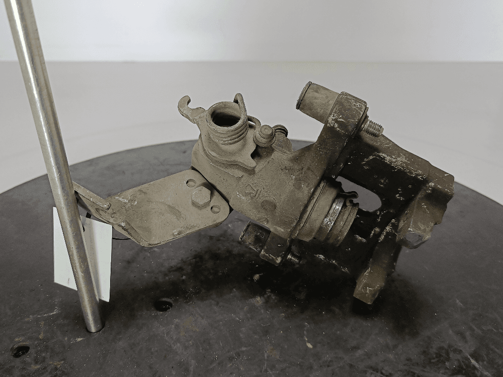 Суппорт задний левый к Nissan  Primera P12 (02-08)