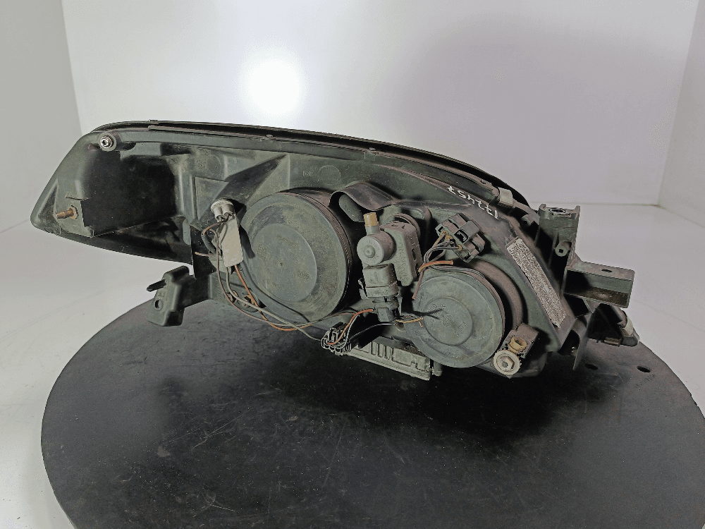 Фара левая к Nissan  Primera P12 (02-08)