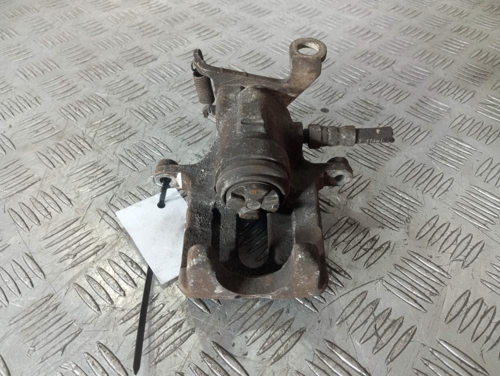 Суппорт задний левый к Ford Focus 1 (98-01)