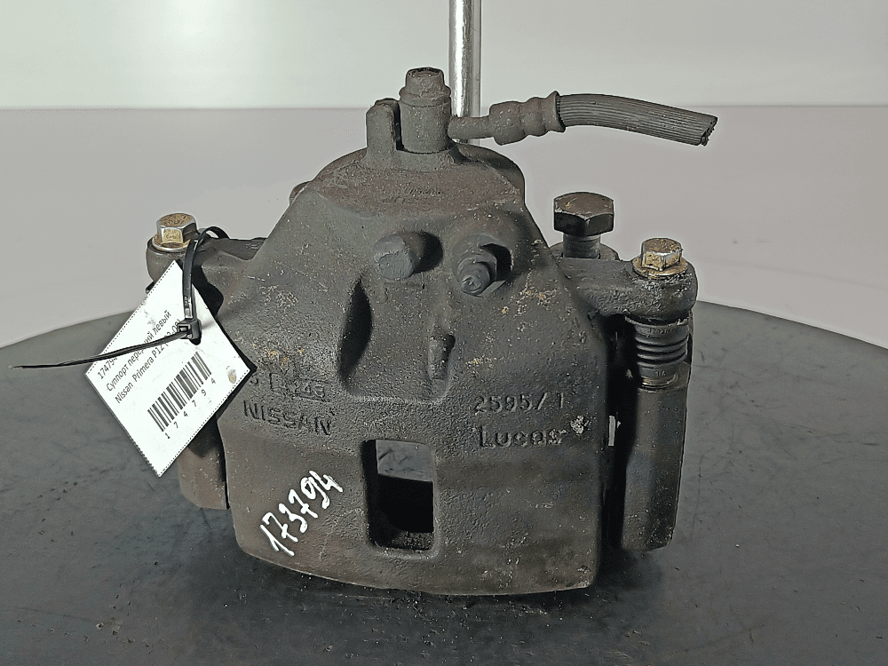 Суппорт передний левый к Nissan  Primera P12 (02-08)