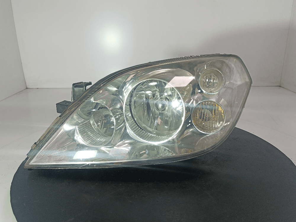 Фара левая к Nissan  Primera P12 (02-08)