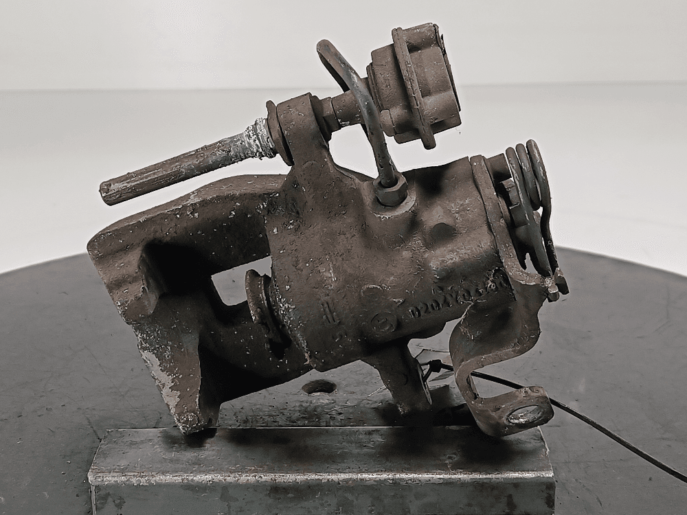 Суппорт задний левый к Citroen C4 Picasso 1 (06-13)