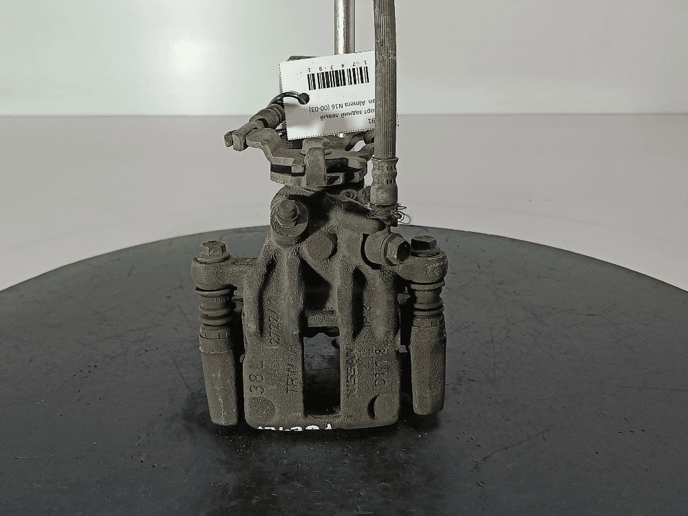 Суппорт задний левый к Nissan  Almera N16 (00-03)