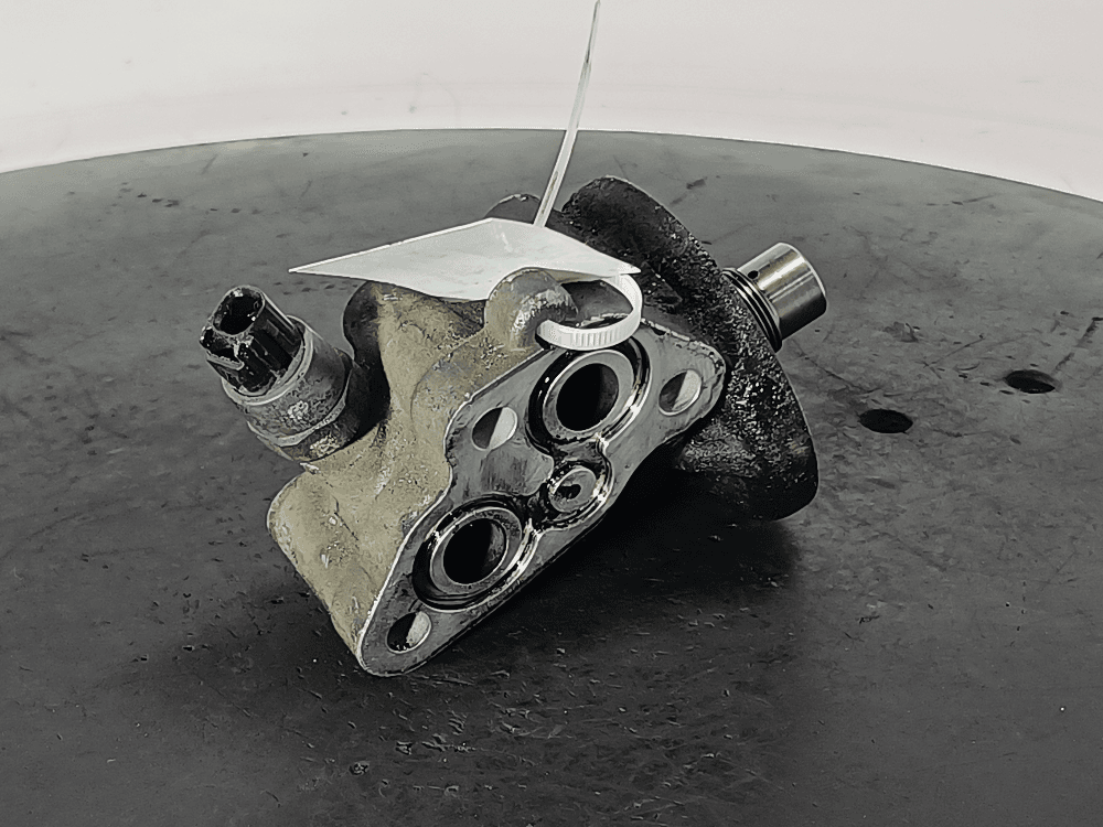 Корпус масляного фильтра к Toyota Avensis 2 (03-06)