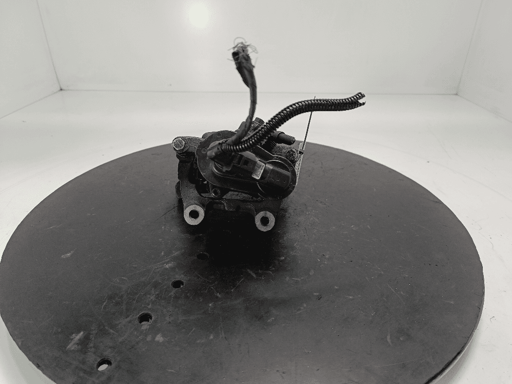 Суппорт задний левый к Volkswagen Passat B6 (05-10)