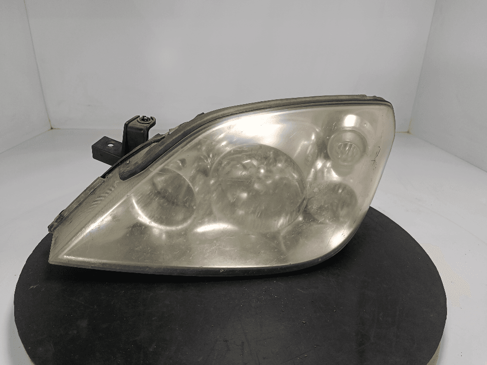 Фара левая к Nissan  Primera P12 (02-08)