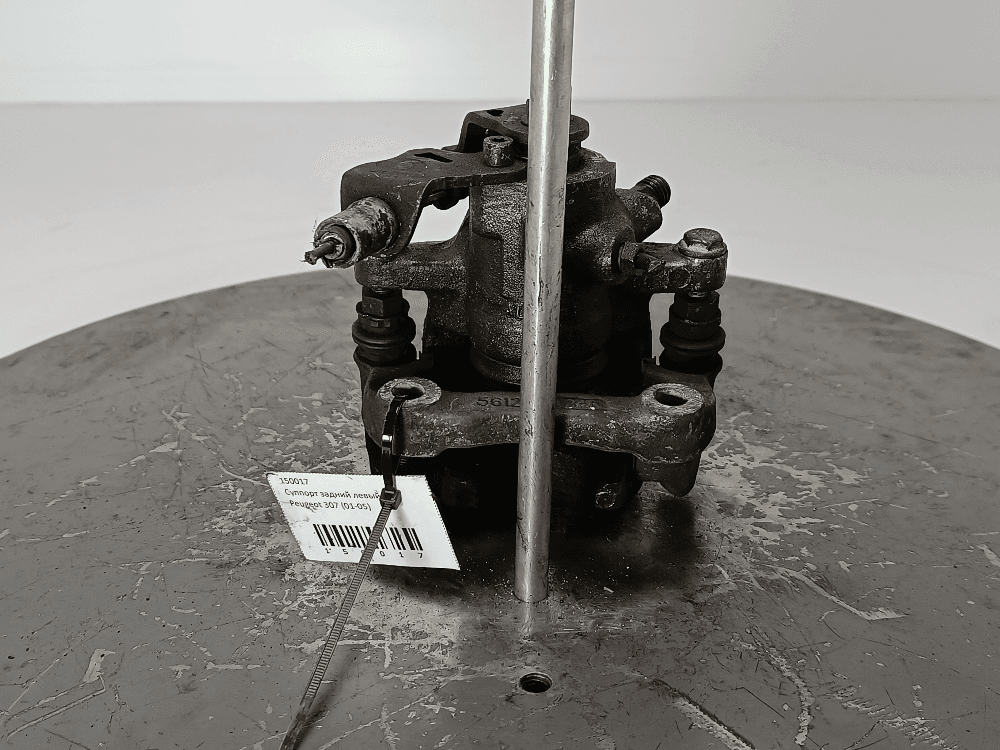 Суппорт задний левый к Peugeot 307 (01-05)