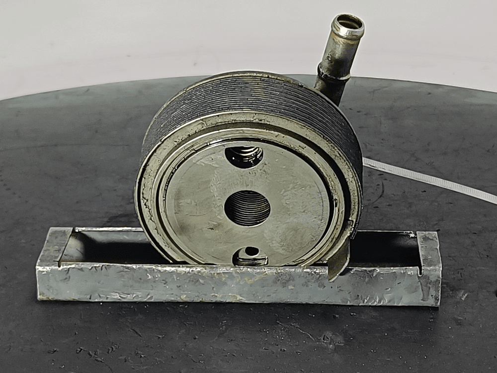 Теплообменник масляного фильтра к Toyota Avensis 2 (03-06)