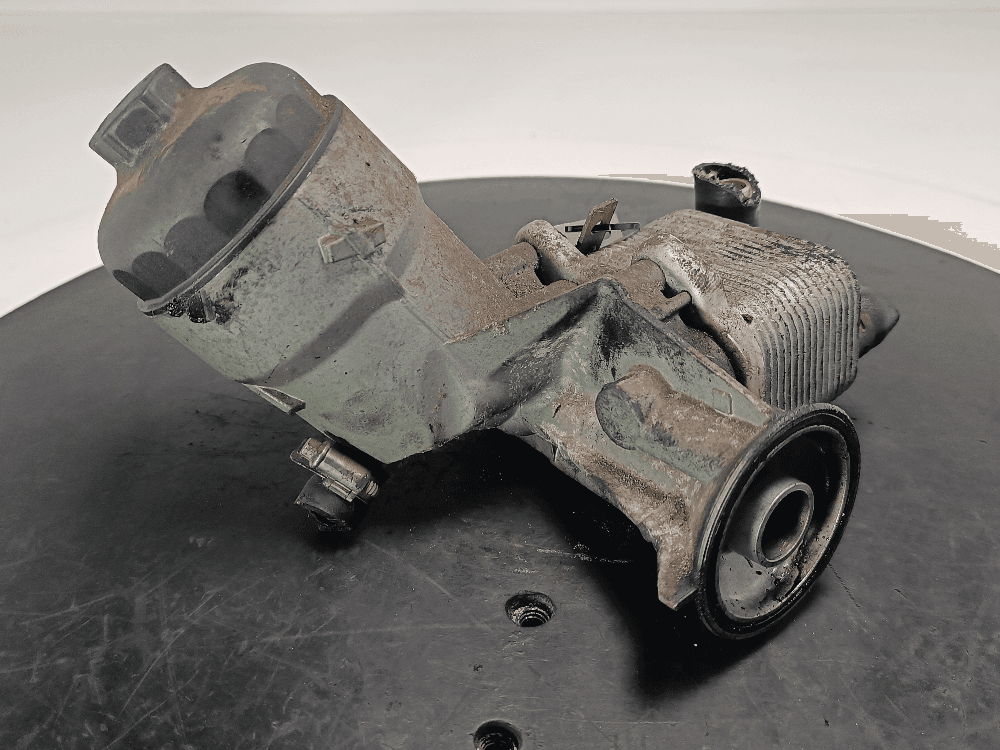 Корпус масляного фильтра к Opel Astra H (04-07)